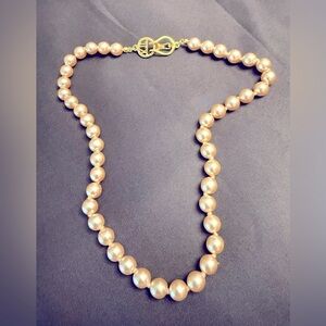 By the master of faux jewelry, Kenneth Jay Lane - PEARLS w/ signature clasp.